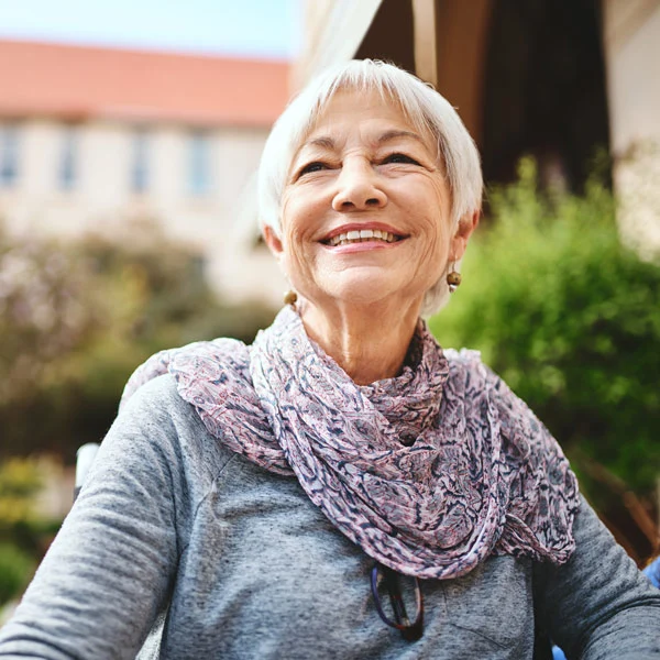 A photograph depicting an elderly woman with a return to a high Quality of Life after having a kyphoplasty and getting proper osteoporosis care for her broken back bone.