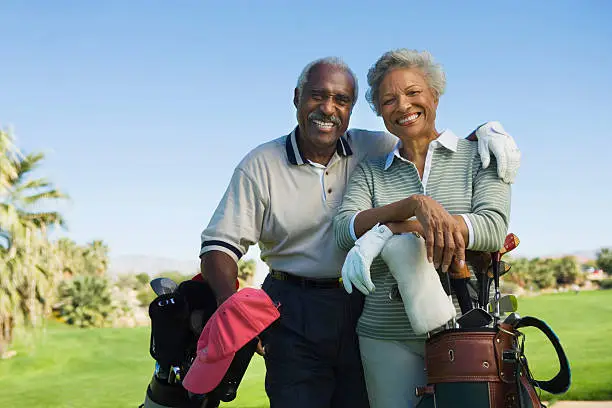 Loving couple golfing pain-free in Ahwatukee after kyphoplasty vertebroplasty for vertebral compression fracture.