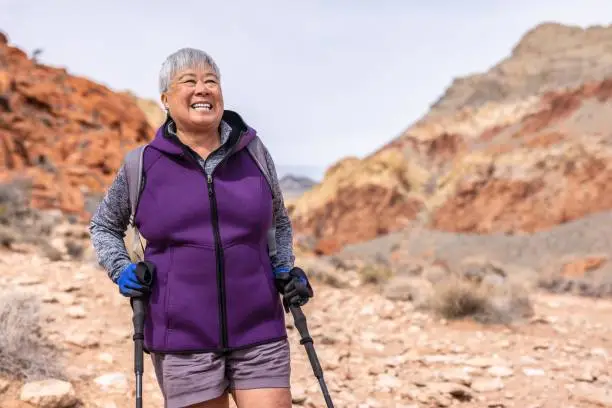 Older woman walking comfortably in Chandler after kyphoplasty for spine fracture