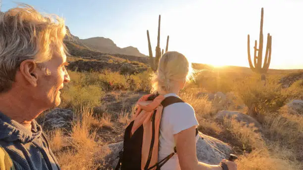 Happy couple enjoying pain-free mobility after kyphoplasty vertebroplasty treatment in Ahwatukee.