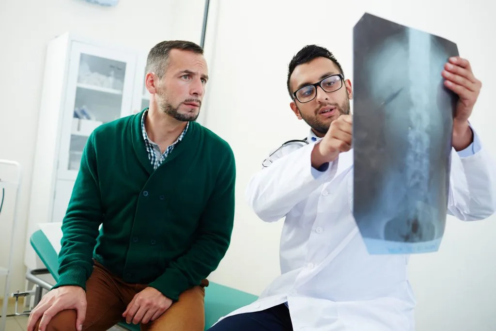 Back pain specialist Casa Grande explaining kyphoplasty vertebroplasty options