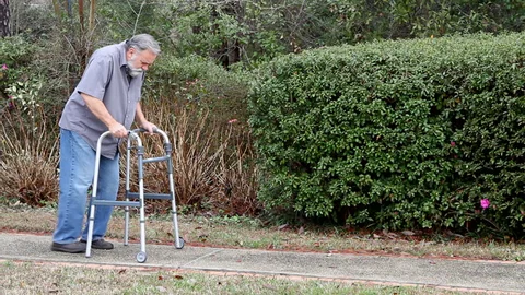 Person with diabetic neuropathy using assistive device for walking