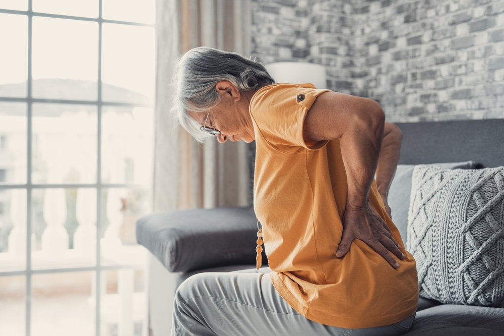 Senior adult experiencing back pain before vertebral compression fracture treatment